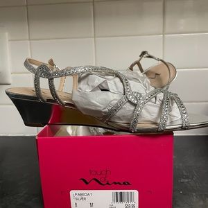 Sandals with 2 inch wedge heel, with Sparling bling. Never worn.